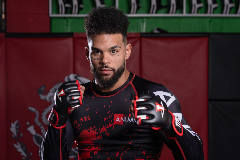 Izaiah Deon competing in MMA fight - men's transformation coach